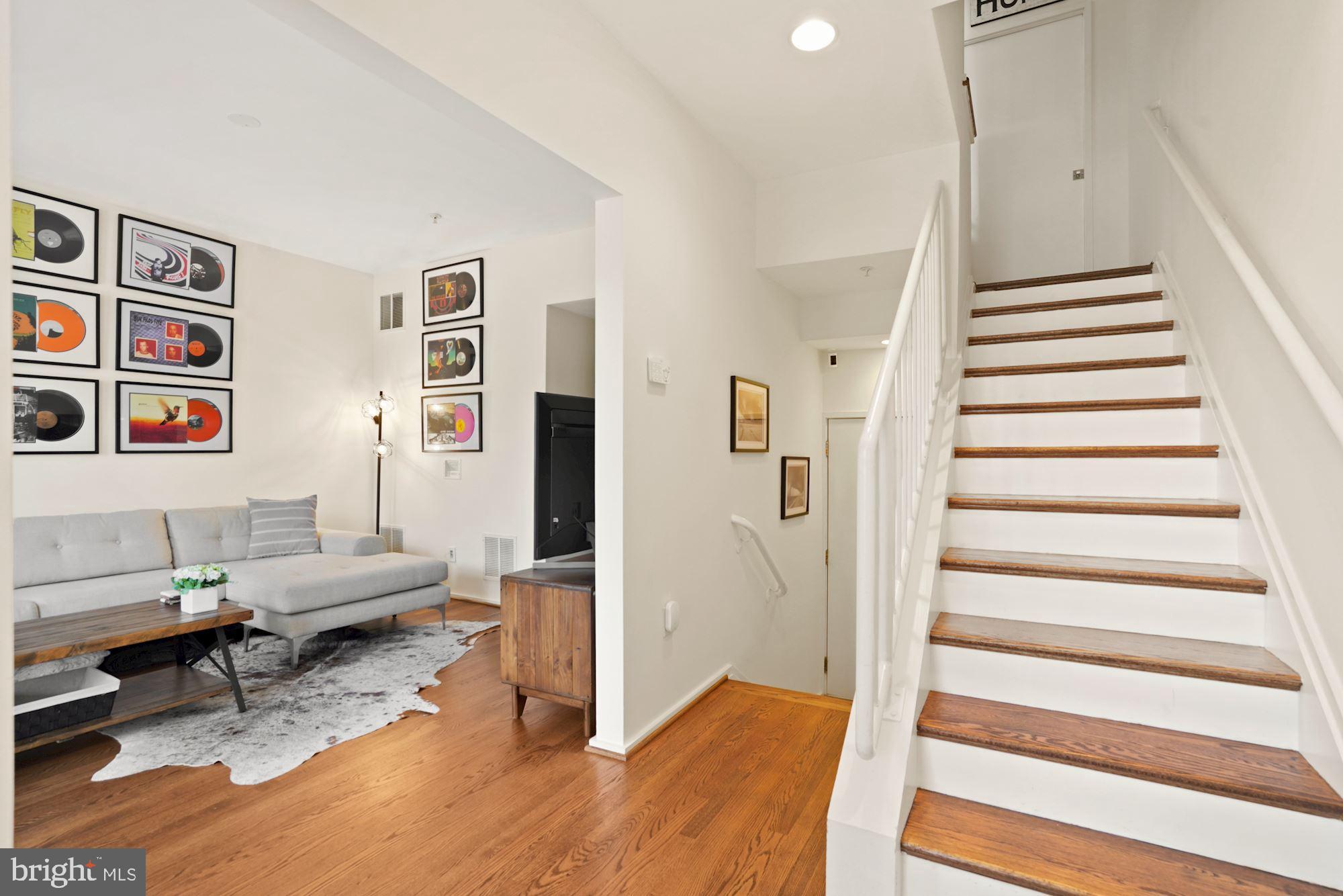 1618 North Rhodes Street Arlington, VA 22209 - Photo 6 of 33 a living room with furniture and wooden floor