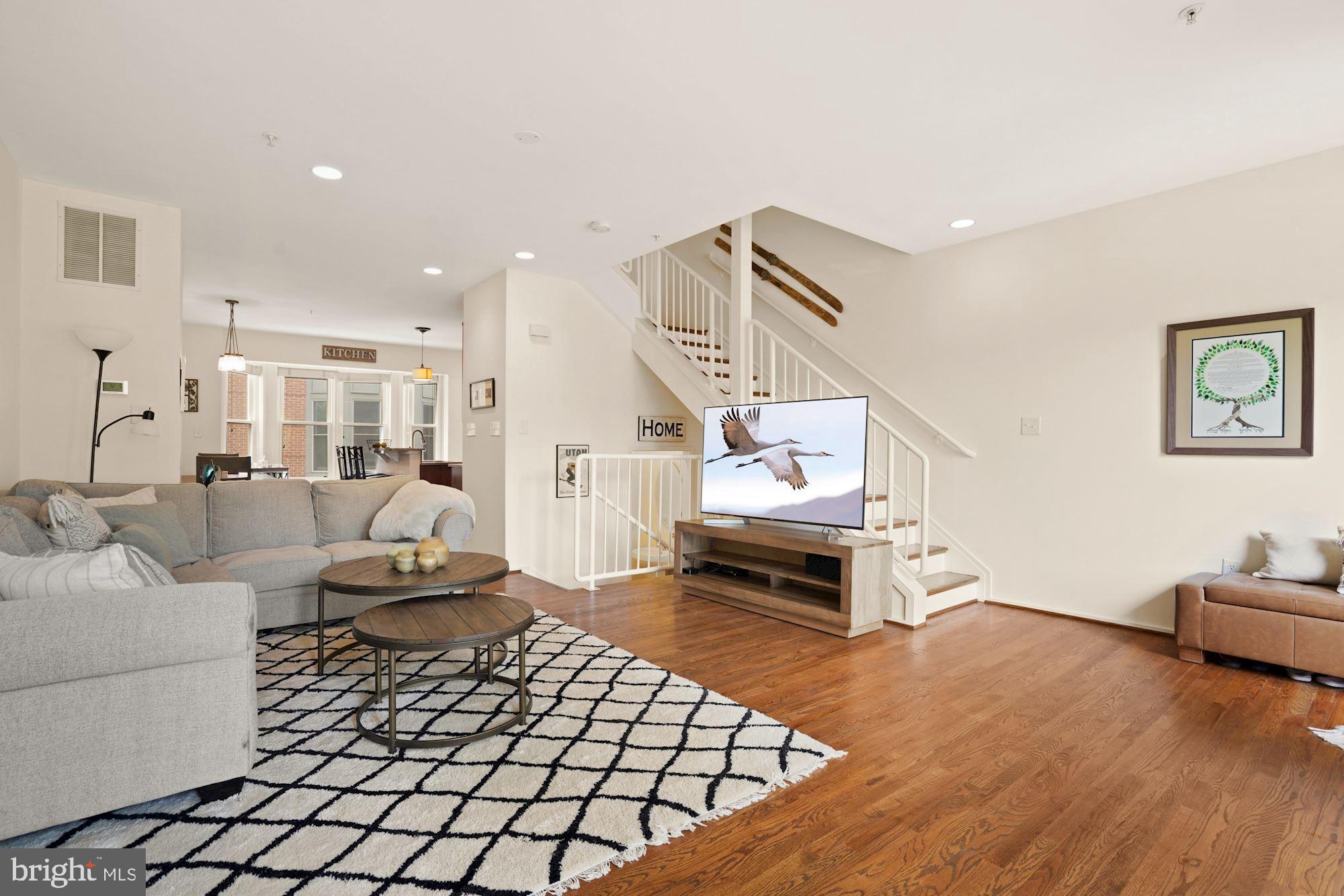 1618 North Rhodes Street Arlington, VA 22209 - Photo 7 of 33 a living room with furniture and a wooden floor