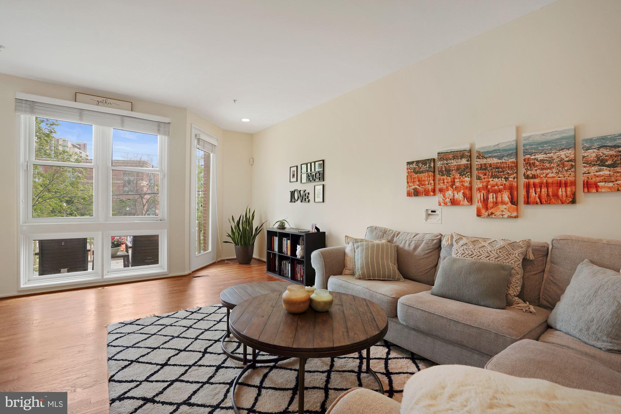 1618 North Rhodes Street Arlington, VA 22209 - Photo 9 of 33 a living room with furniture and a large window
