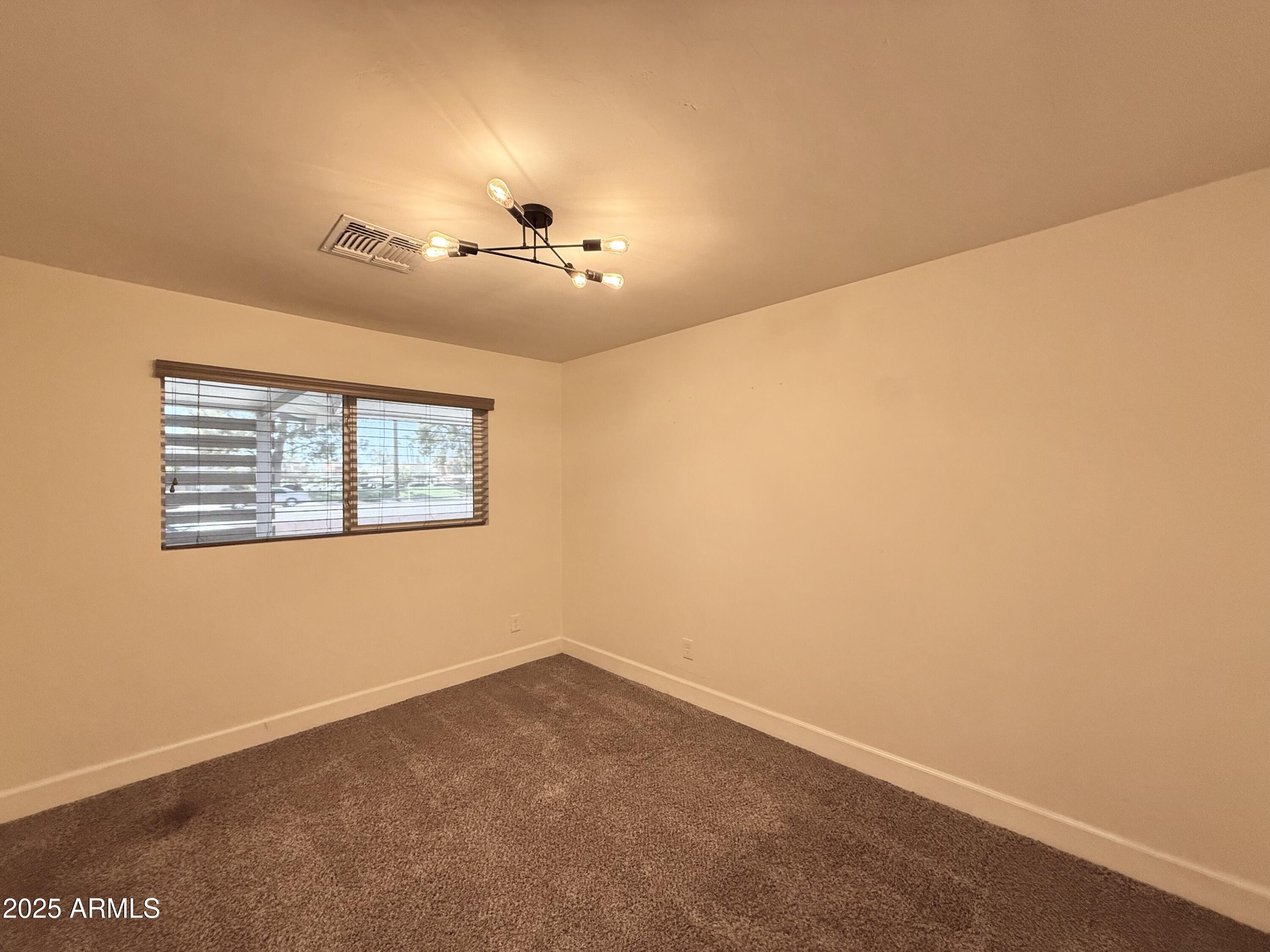 3625 North Hayden Road Scottsdale, AZ 85251 - Photo 11 of 24 an empty room with windows