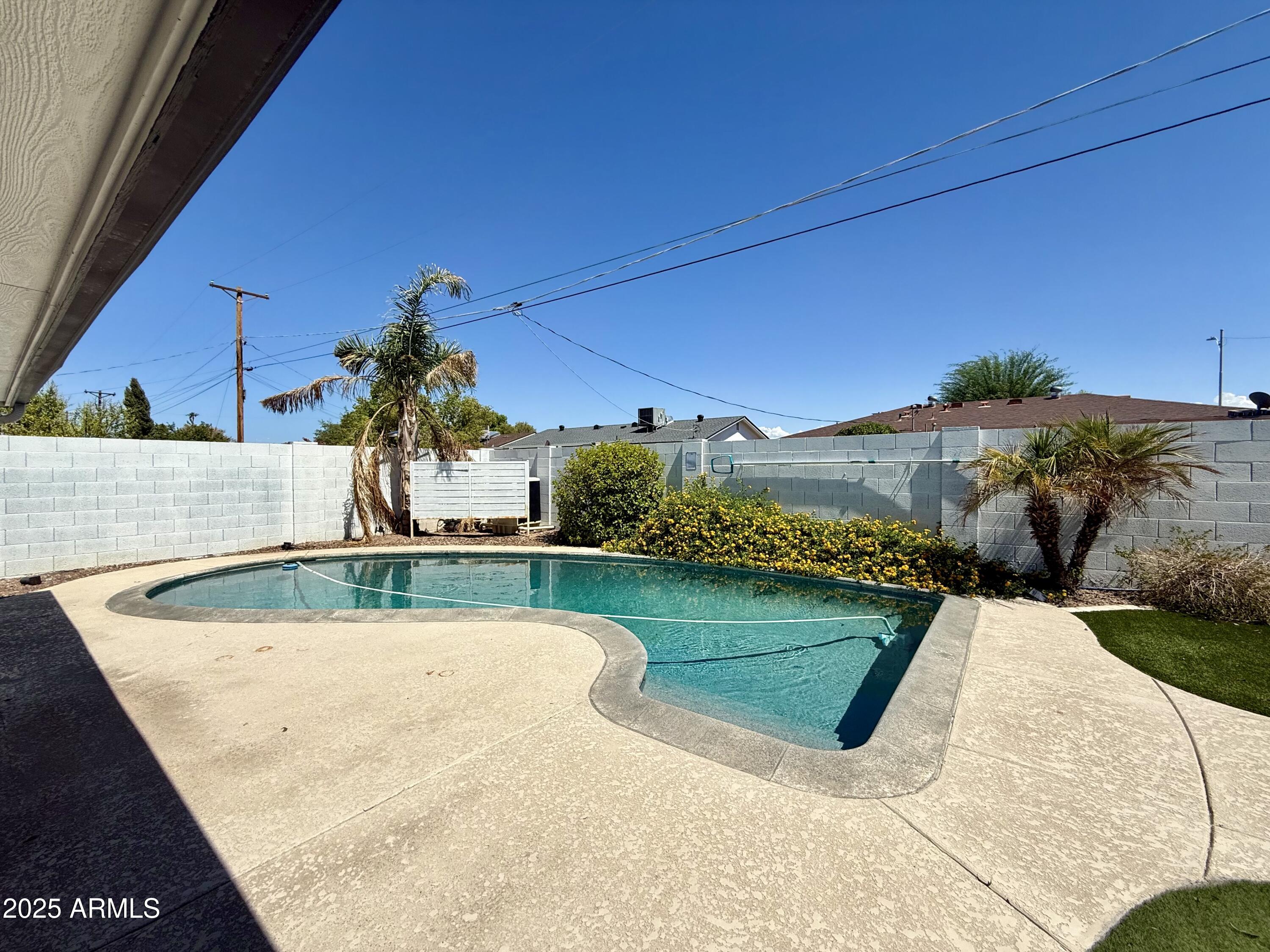 3625 North Hayden Road Scottsdale, AZ 85251 - Photo 21 of 24 a view of a swimming pool with a patio