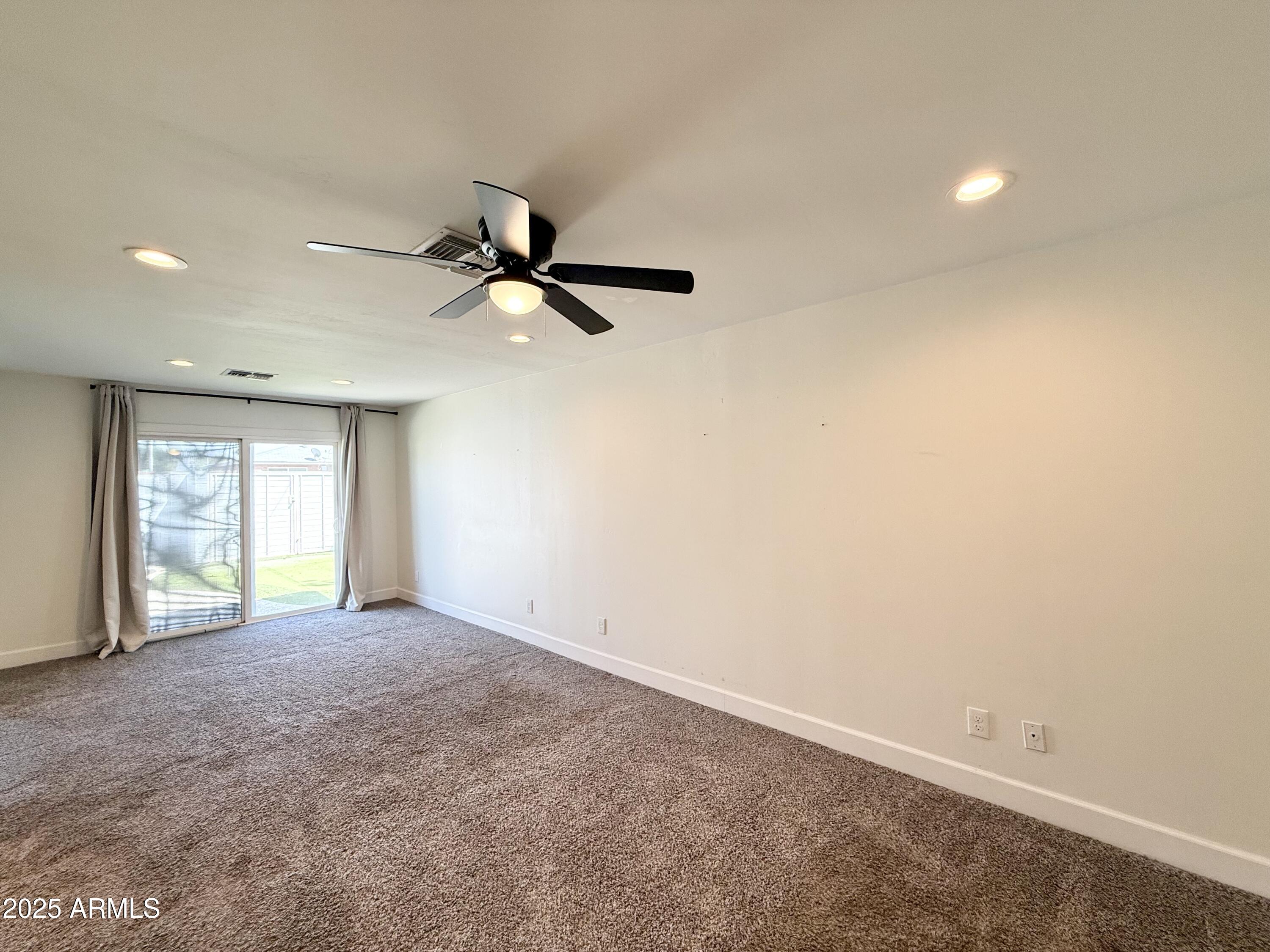 3625 North Hayden Road Scottsdale, AZ 85251 - Photo 9 of 24 a view of an empty room with a window