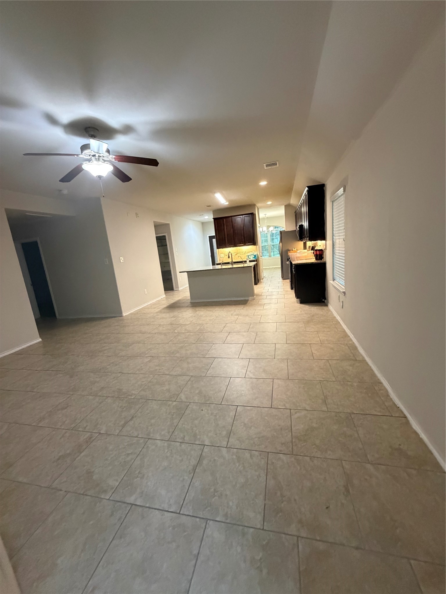 24307 Hampton Terrace Lane Spring, TX 77389 - Photo 7 of 20 Spacious open-concept living area seamlessly connecting the living room, kitchen, and dining room.