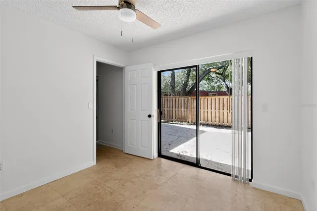a view of a hallway with entryway and workspace