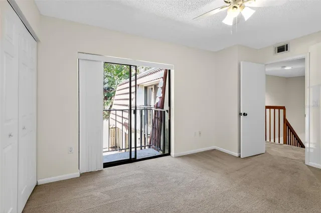 a kitchen with appliances a sink and cabinets