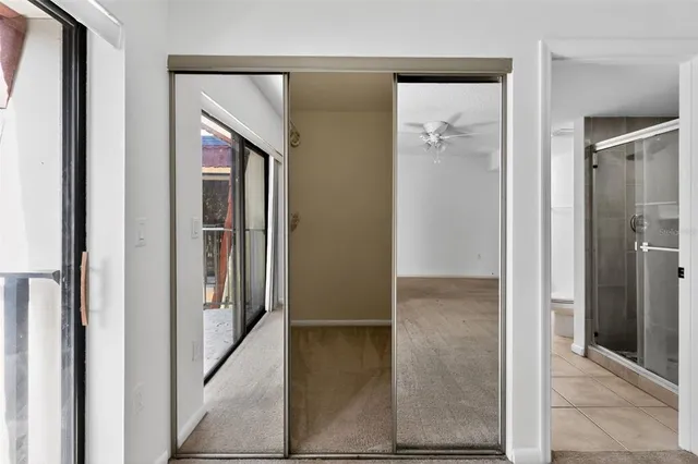 a bathroom with a shower curtain and a toilet
