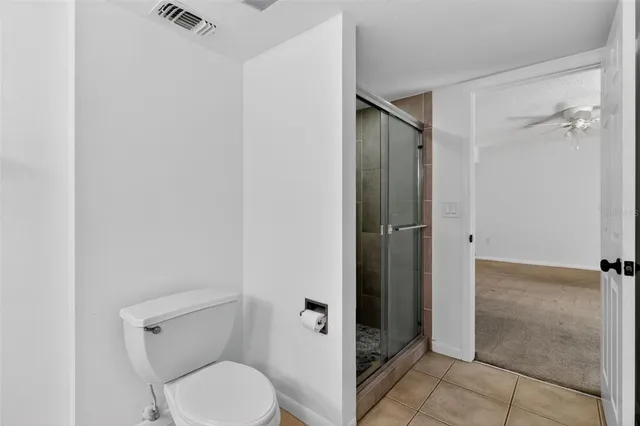 a view of a park with large trees