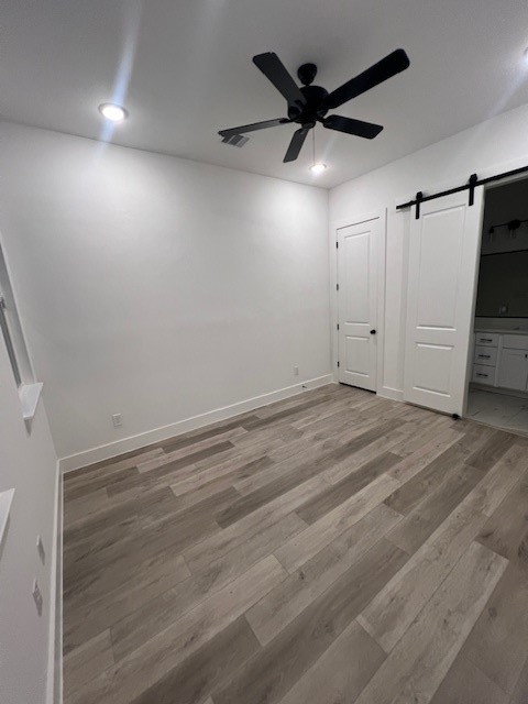 8508 Wileyvale Road, Unit B Houston, TX 77016 - Photo 6 of 16 an empty room with wooden floor and windows