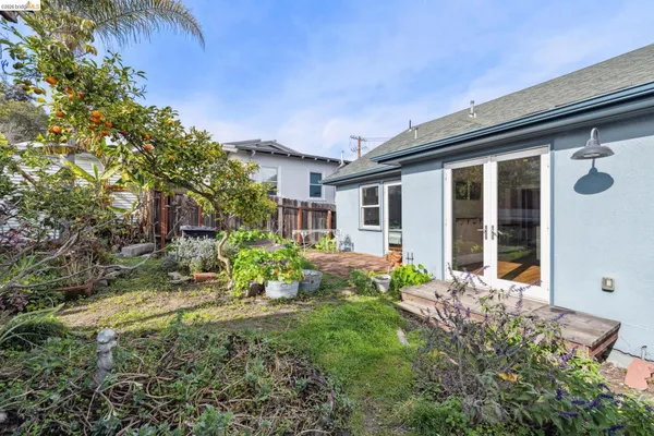 a view of a house with yard and sitting area