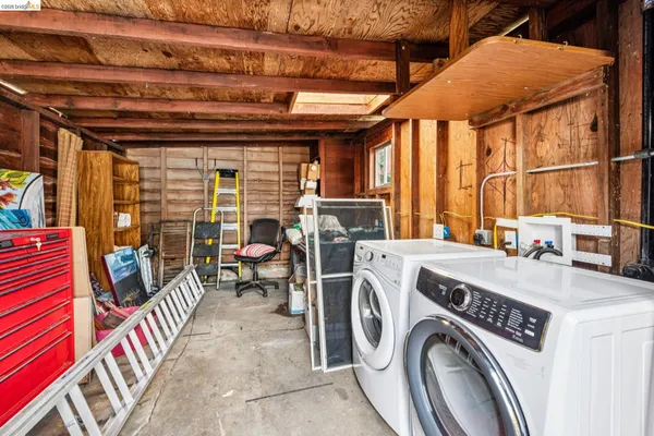 a view of livingroom with washer and dryer