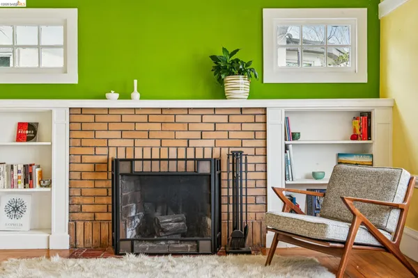 a living room with a couch and a bookshelf