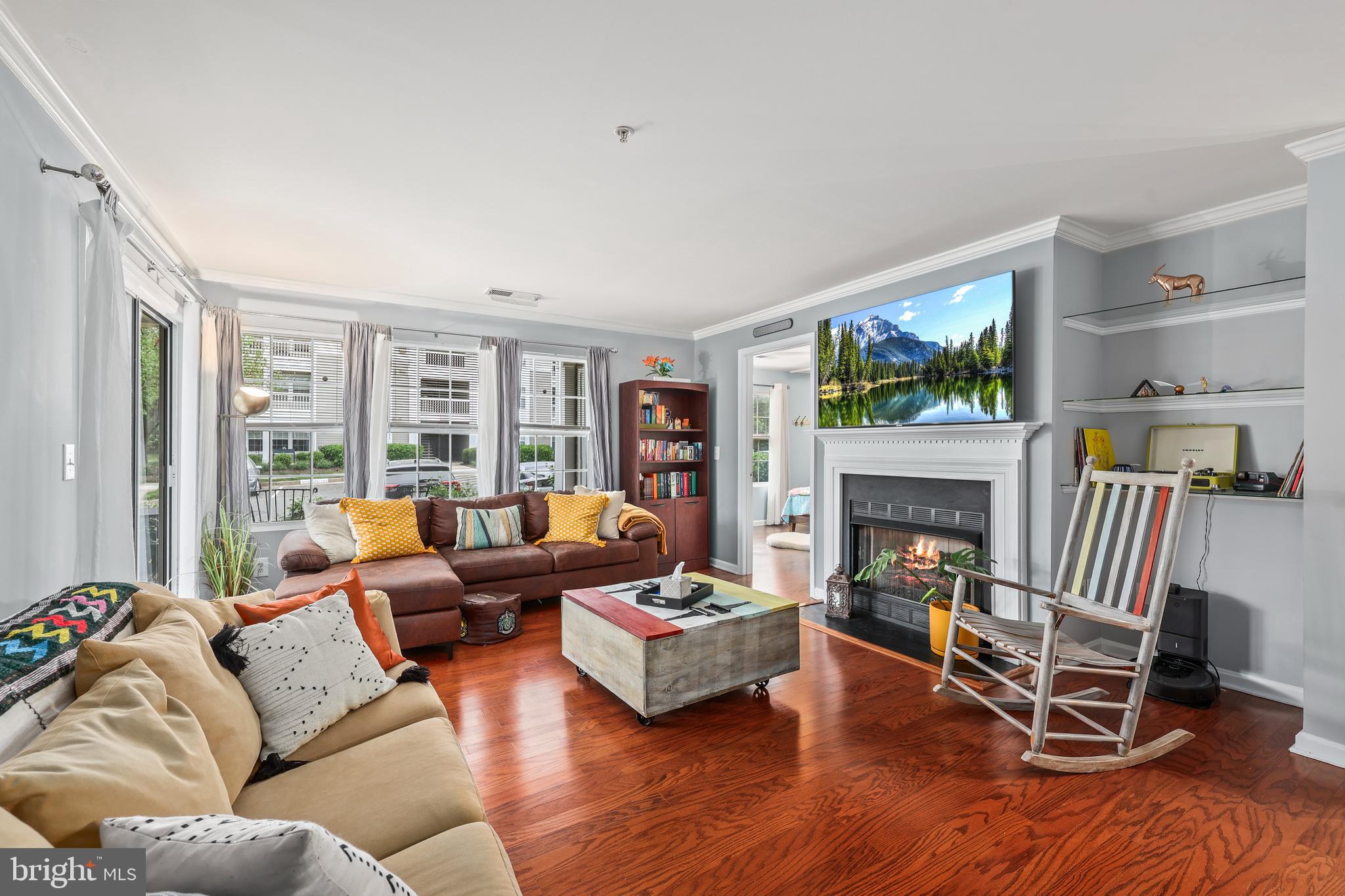 14197 Cuddy Loop, Unit 104 Woodbridge, VA 22193 - Photo 11 of 33 a living room with furniture and a fireplace