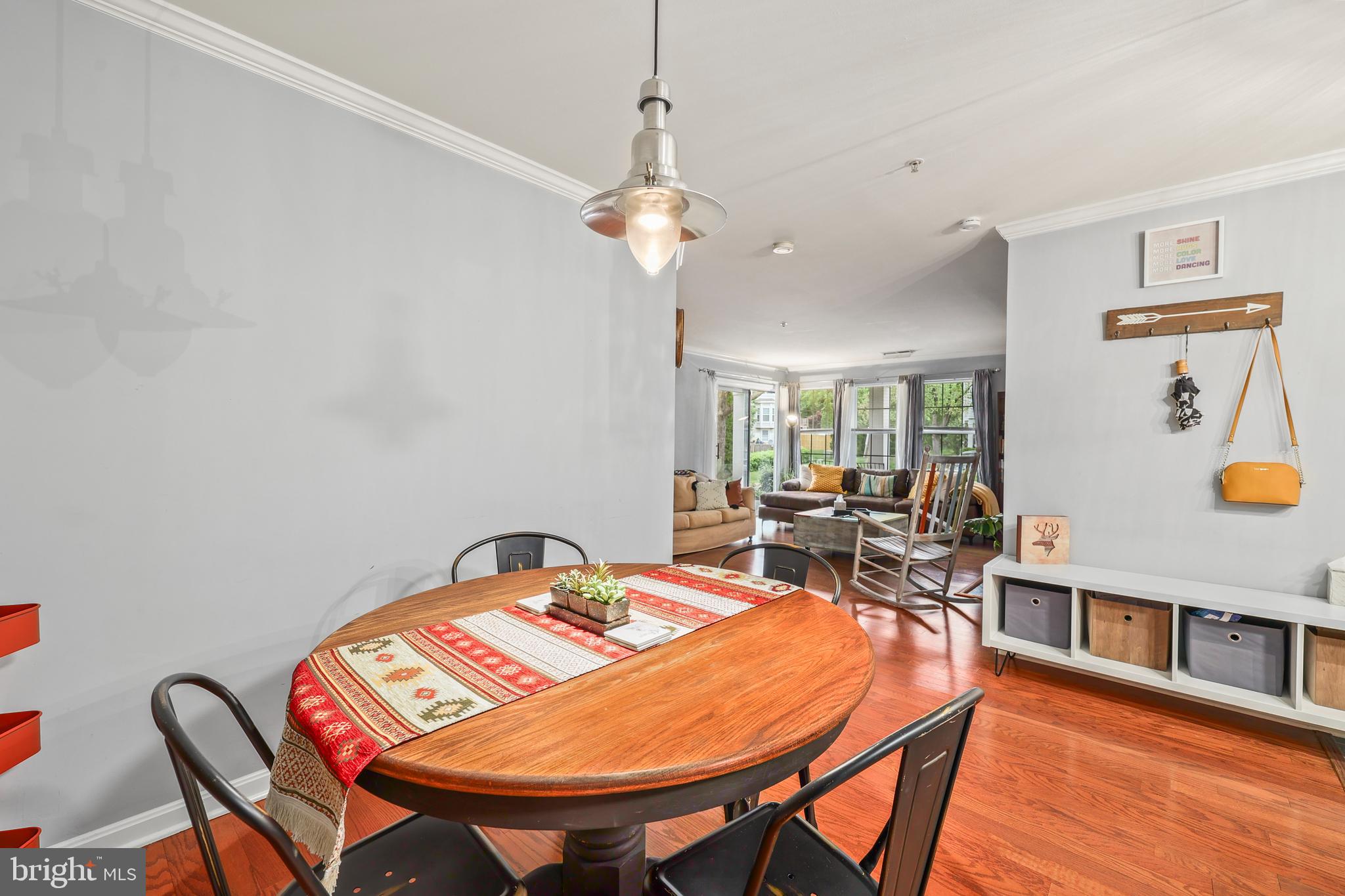 14197 Cuddy Loop, Unit 104 Woodbridge, VA 22193 - Photo 13 of 33 a view of a dining room with furniture and wooden floor