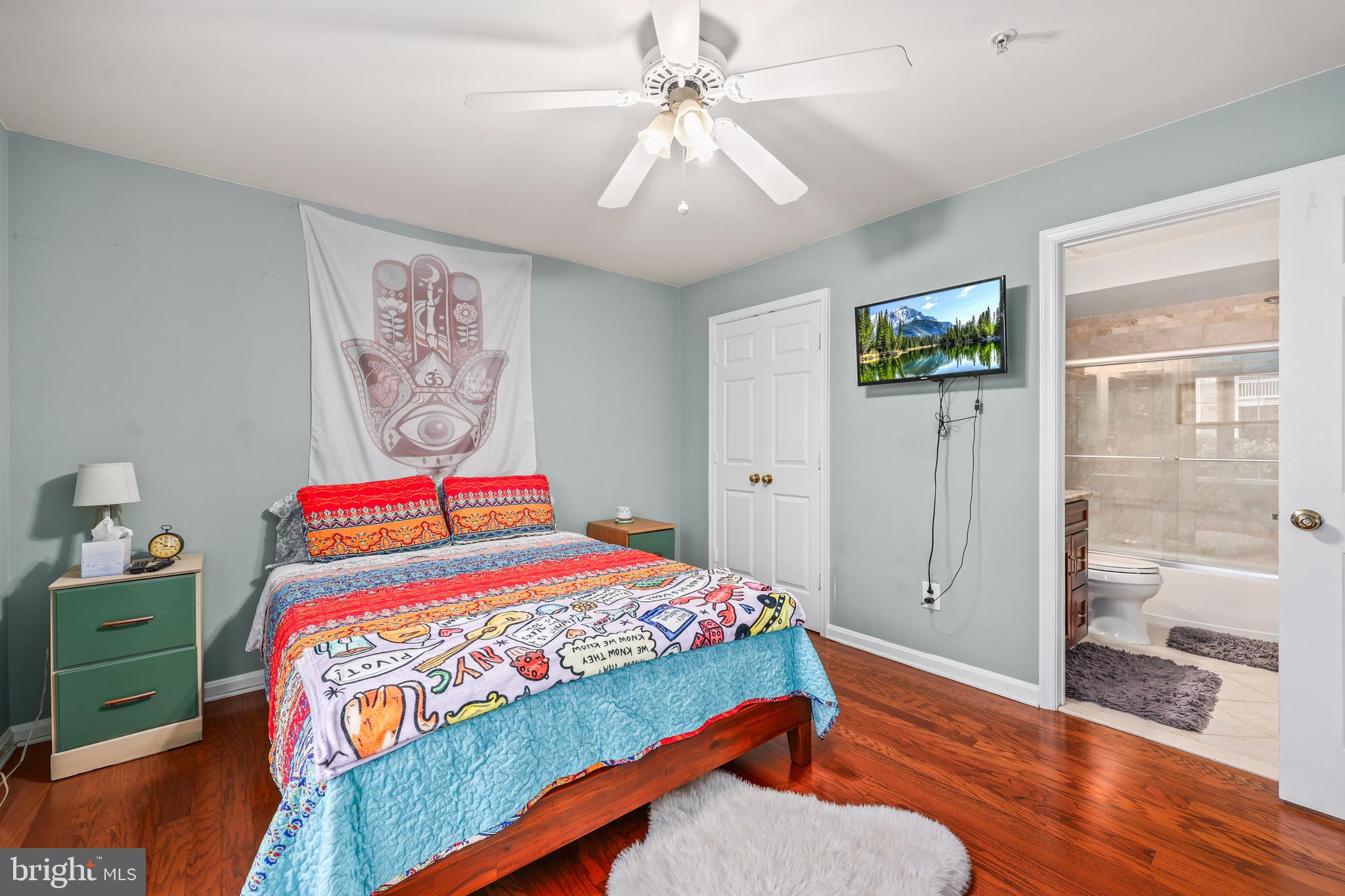 14197 Cuddy Loop, Unit 104 Woodbridge, VA 22193 - Photo 15 of 33 a bedroom with a bed and a chandelier