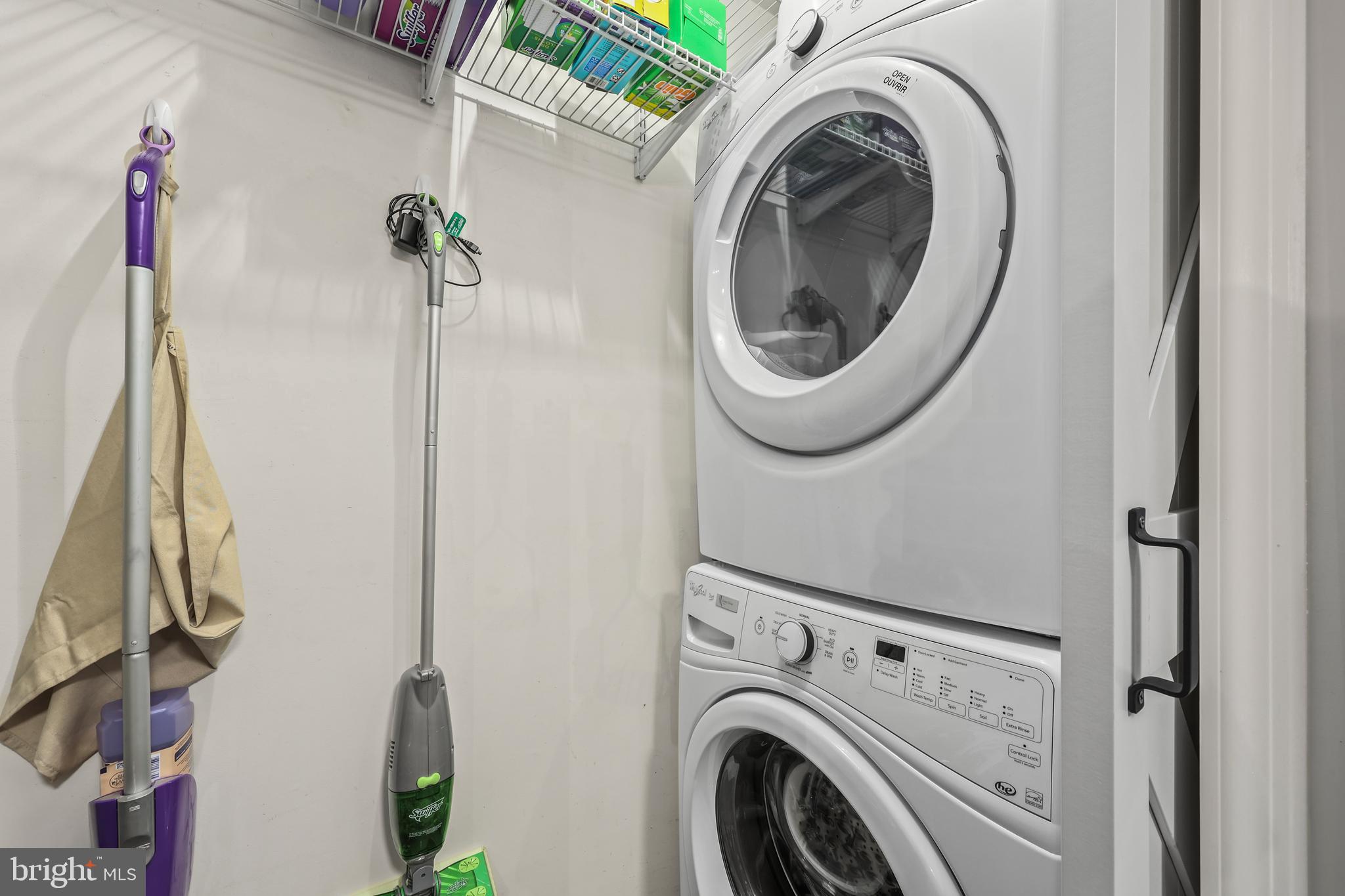 14197 Cuddy Loop, Unit 104 Woodbridge, VA 22193 - Photo 25 of 33 a utility room with dryer and washer