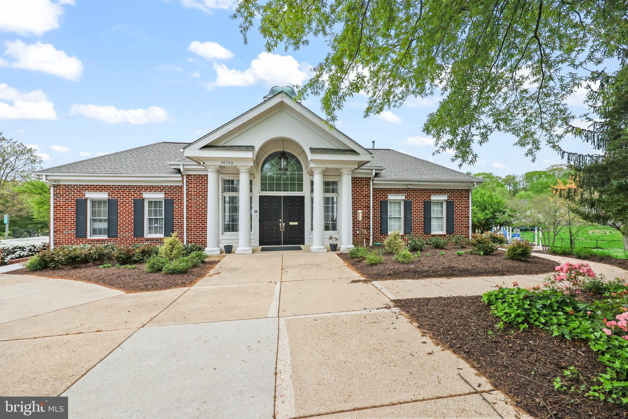 14197 Cuddy Loop, Unit 104 Woodbridge, VA 22193 - Photo 28 of 33 front view of a house with a yard