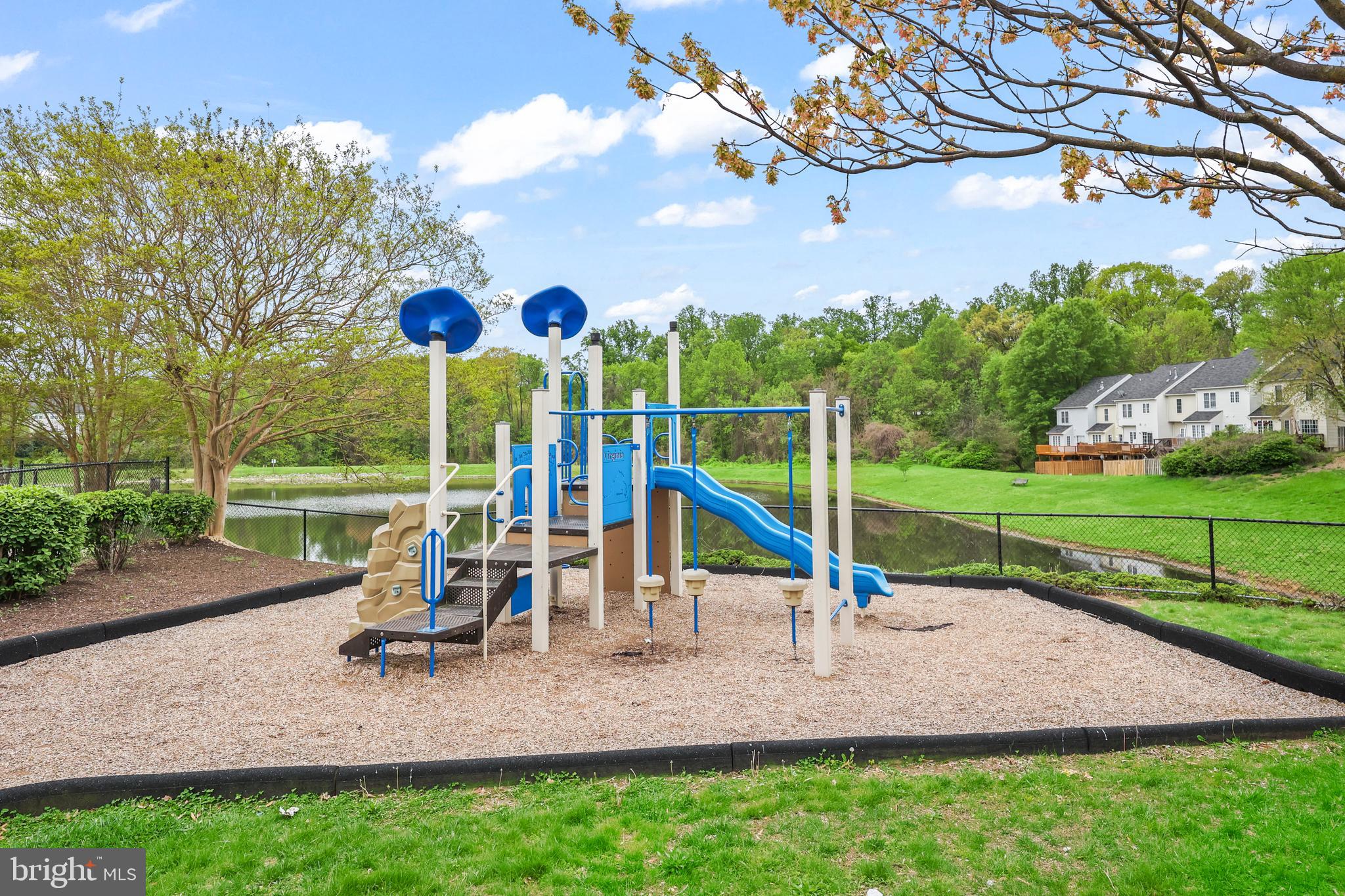 14197 Cuddy Loop, Unit 104 Woodbridge, VA 22193 - Photo 31 of 33 a view of a park with slide
