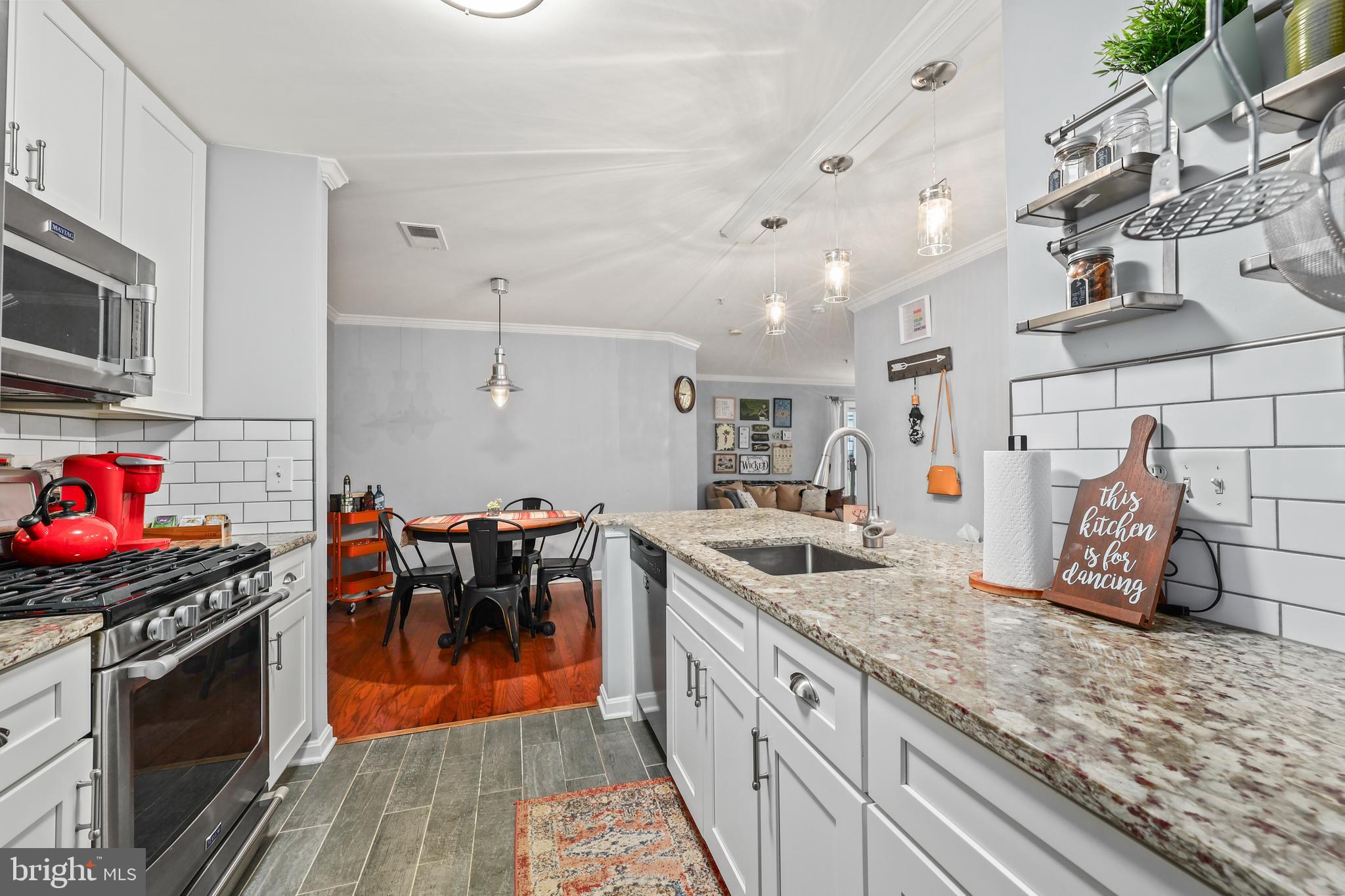 14197 Cuddy Loop, Unit 104 Woodbridge, VA 22193 - Photo 7 of 33 a kitchen with lots of counter top space