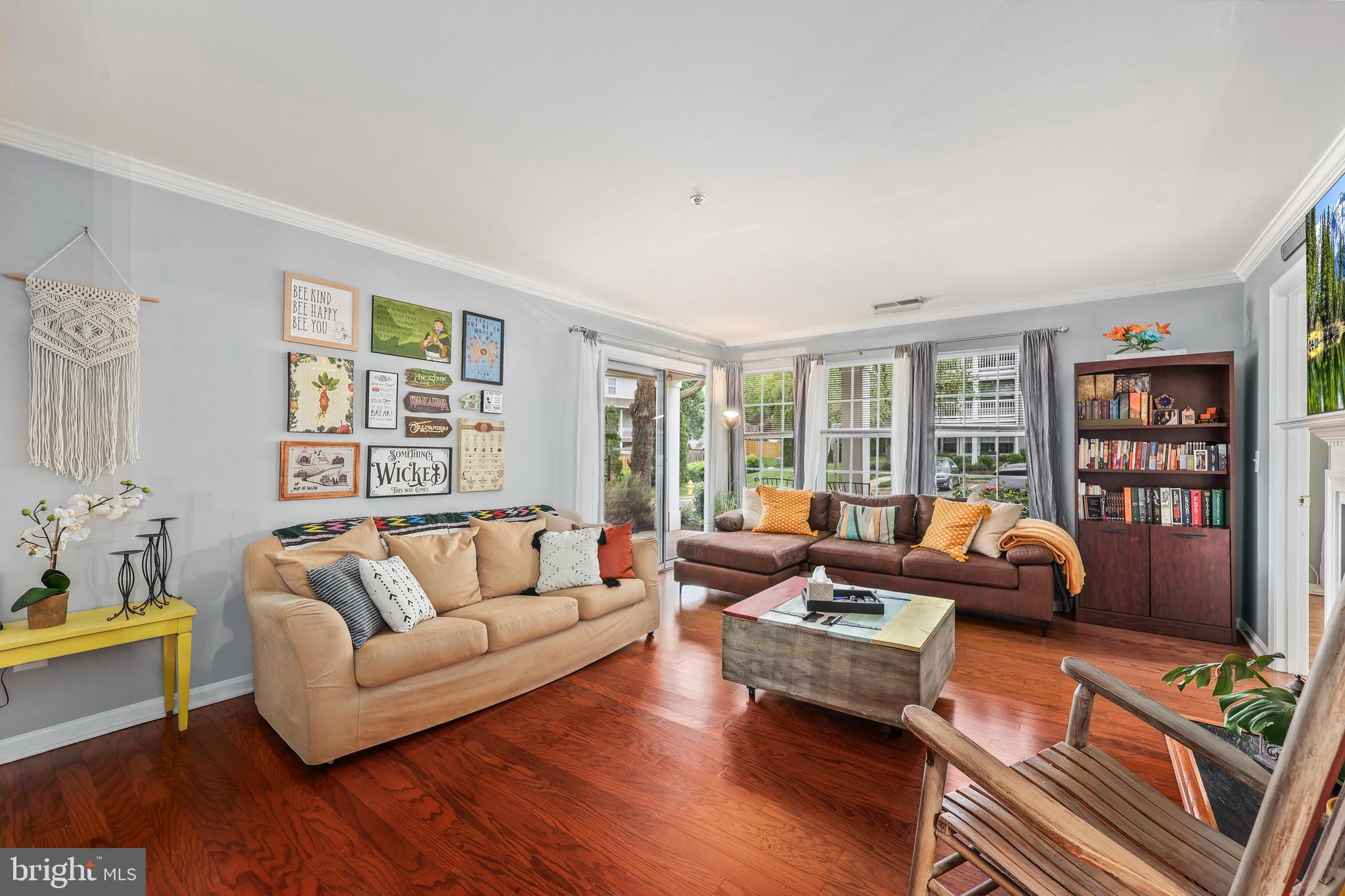 14197 Cuddy Loop, Unit 104 Woodbridge, VA 22193 - Photo 9 of 33 a living room with furniture and a large window