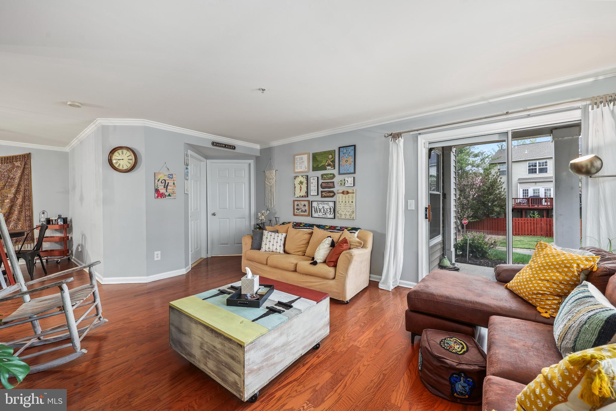 14197 Cuddy Loop, Unit 104 Woodbridge, VA 22193 - Photo 10 of 33 a living room with furniture and wooden floor