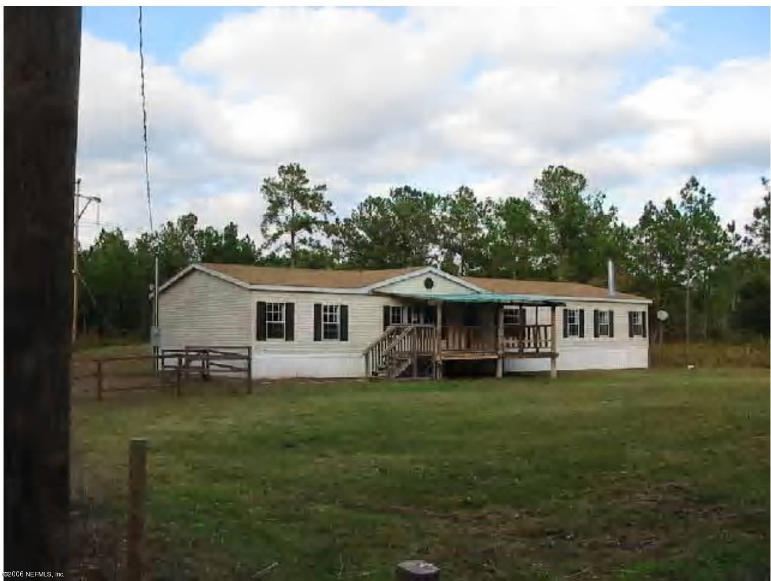 45190 Eula B Road Callahan, FL 32011 - Photo 1 of 1 a view of a house with a yard and trees