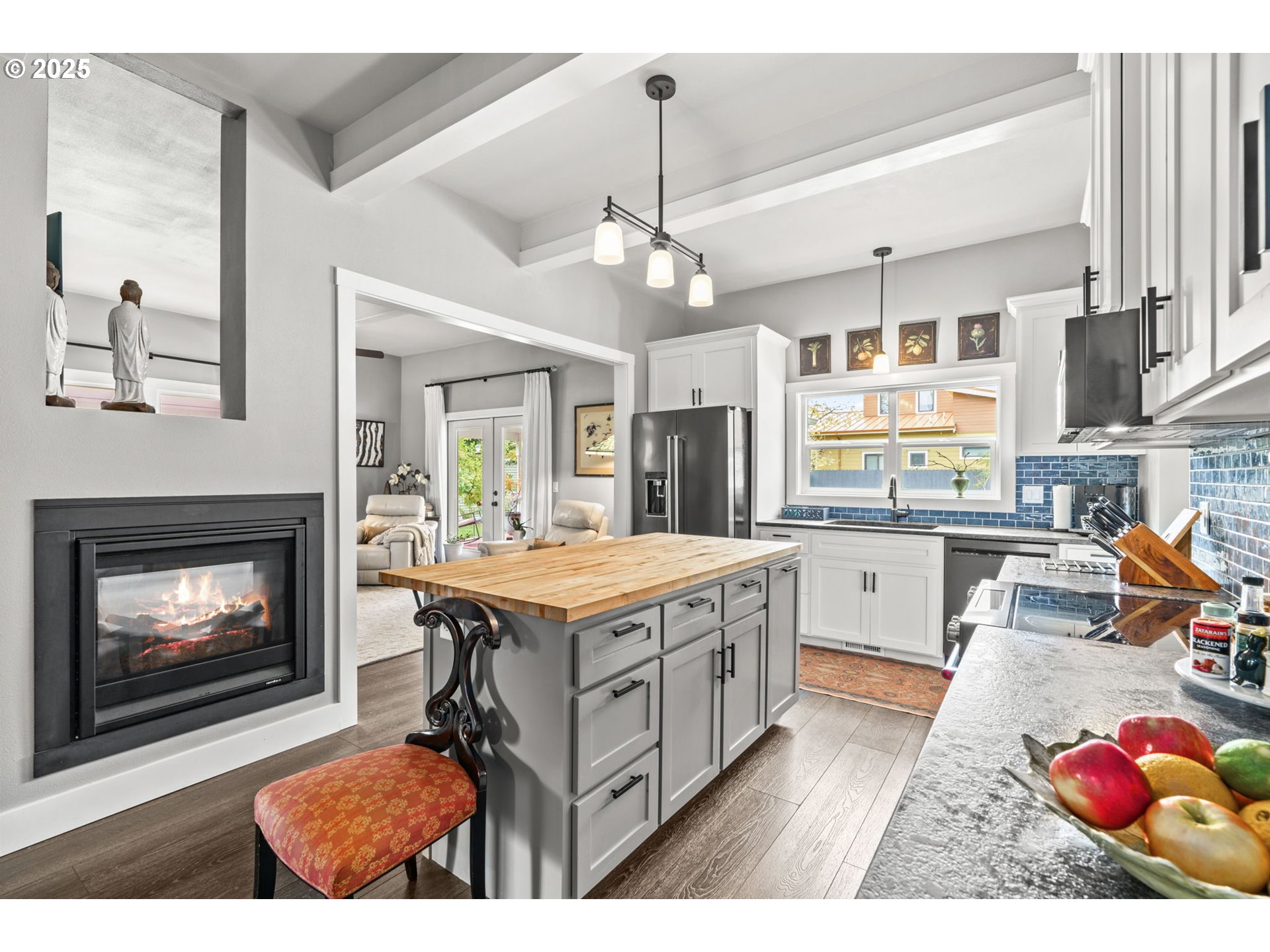 335 North H Street Cottage Grove, OR 97424 - Photo 11 of 45 a open kitchen with stainless steel appliances granite countertop a stove top oven a sink dishwasher and a fireplace with wooden floor