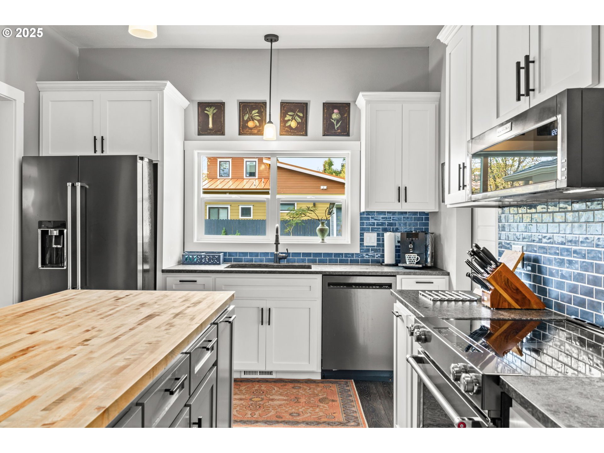 335 North H Street Cottage Grove, OR 97424 - Photo 12 of 45 a kitchen with stainless steel appliances granite countertop a stove and a refrigerator