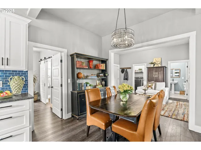 a view of a dining room with furniture wooden floor and chandelier