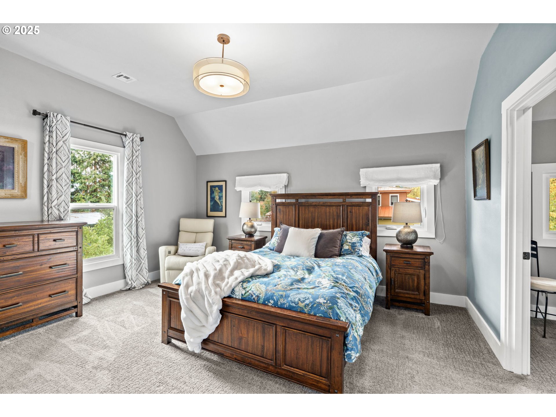 335 North H Street Cottage Grove, OR 97424 - Photo 29 of 45 a bedroom with a bed and wooden floor