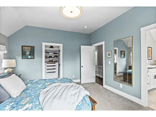 a bedroom with a bed and a cabinets