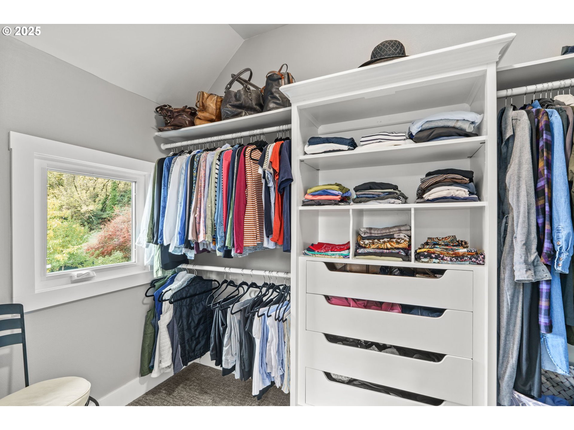 335 North H Street Cottage Grove, OR 97424 - Photo 31 of 45 a view of walk in closet with clothes and shoes