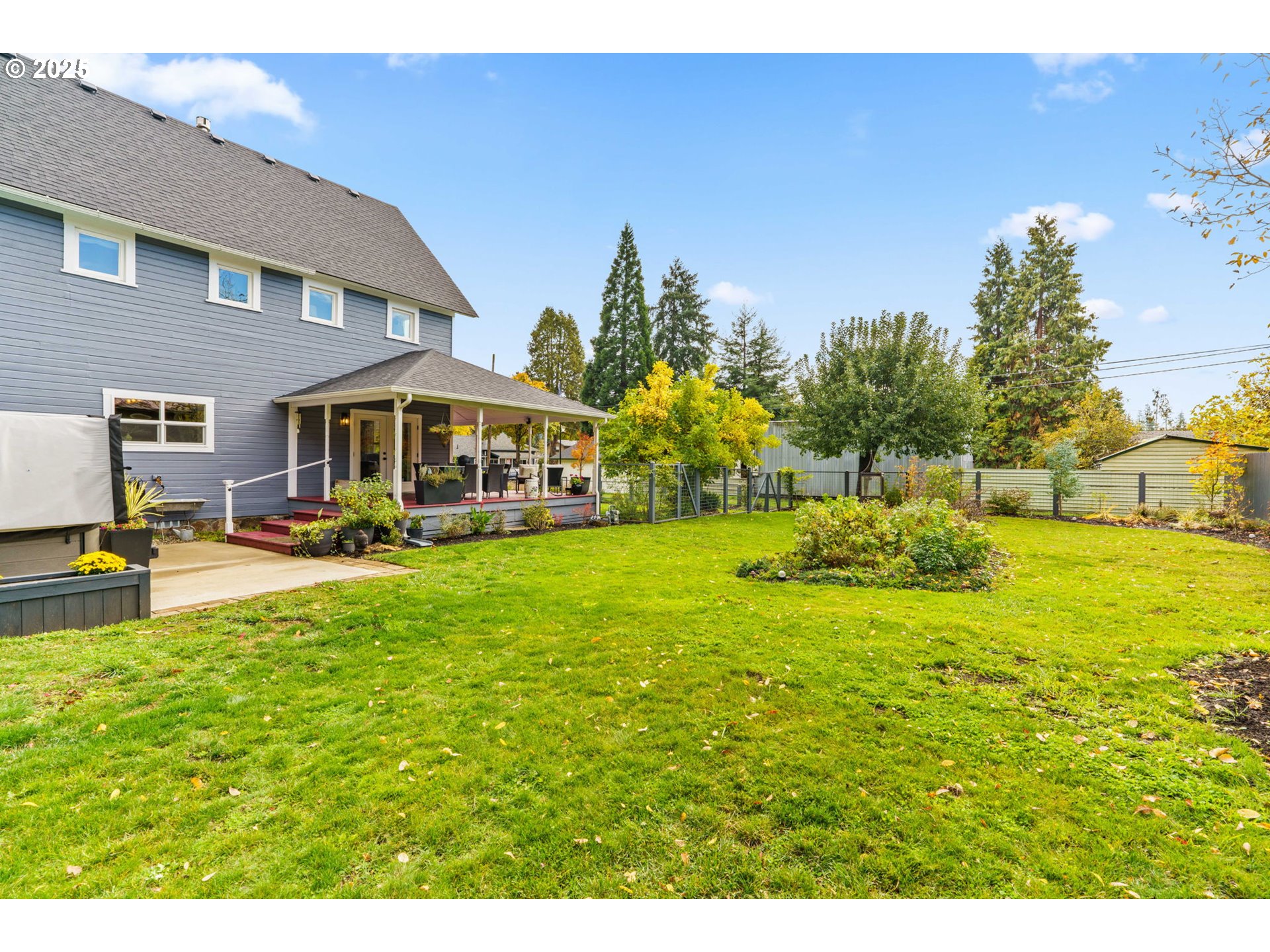 335 North H Street Cottage Grove, OR 97424 - Photo 38 of 45 a view of an house with backyard and a tree