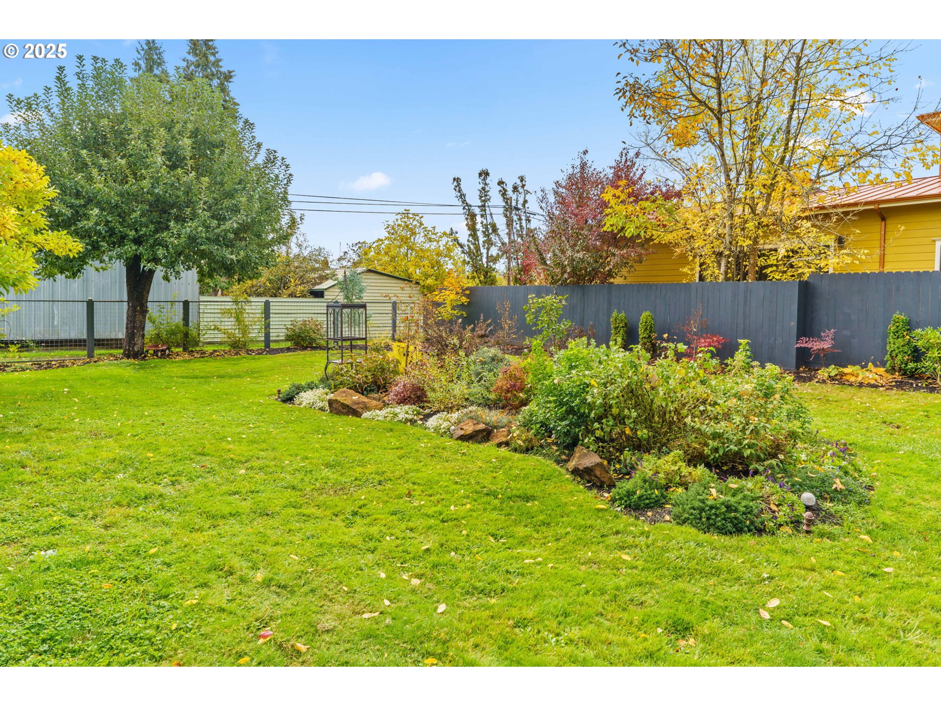 335 North H Street Cottage Grove, OR 97424 - Photo 40 of 45 a view of a garden with a building