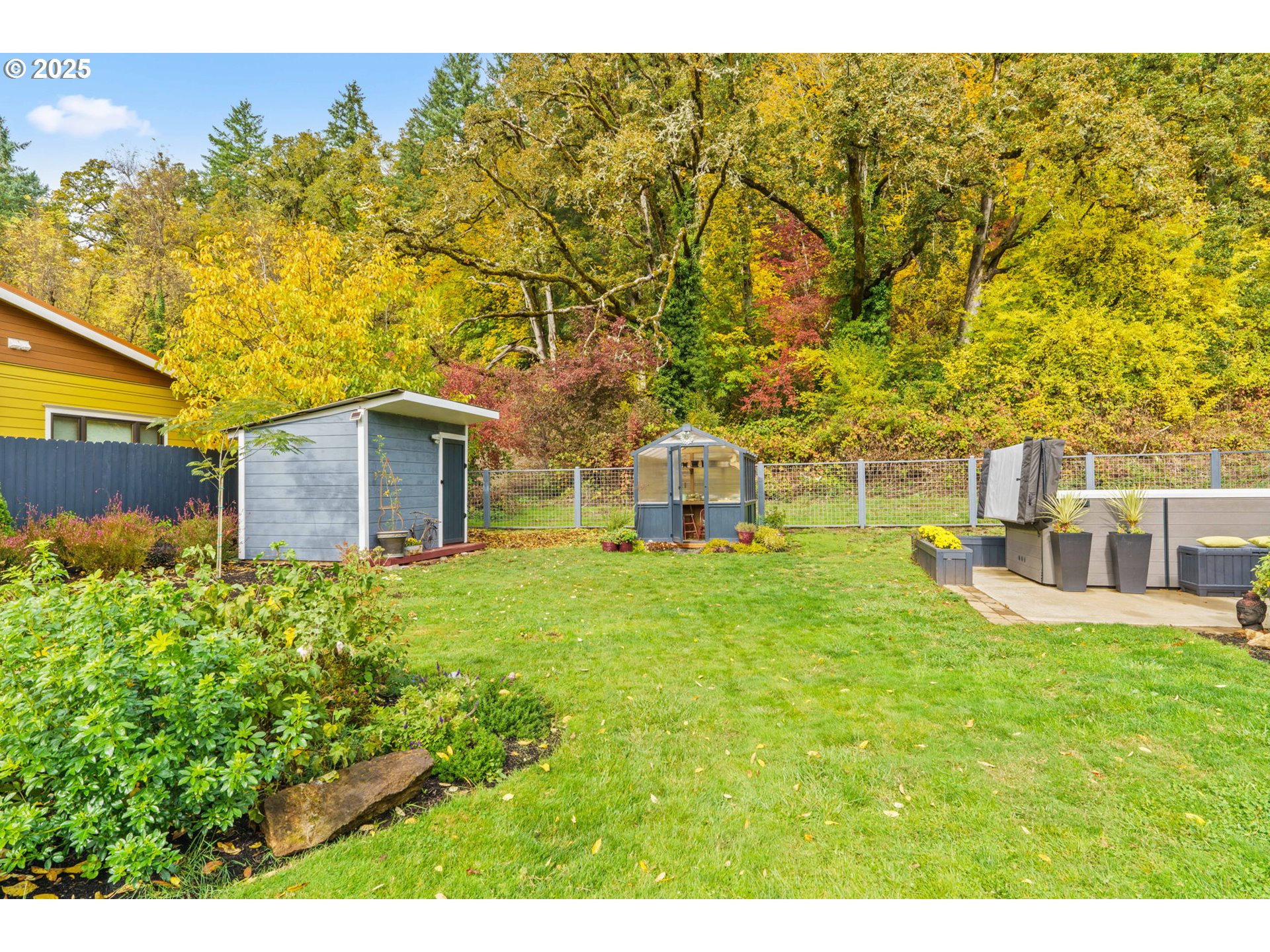 335 North H Street Cottage Grove, OR 97424 - Photo 43 of 45 a house view with a garden space