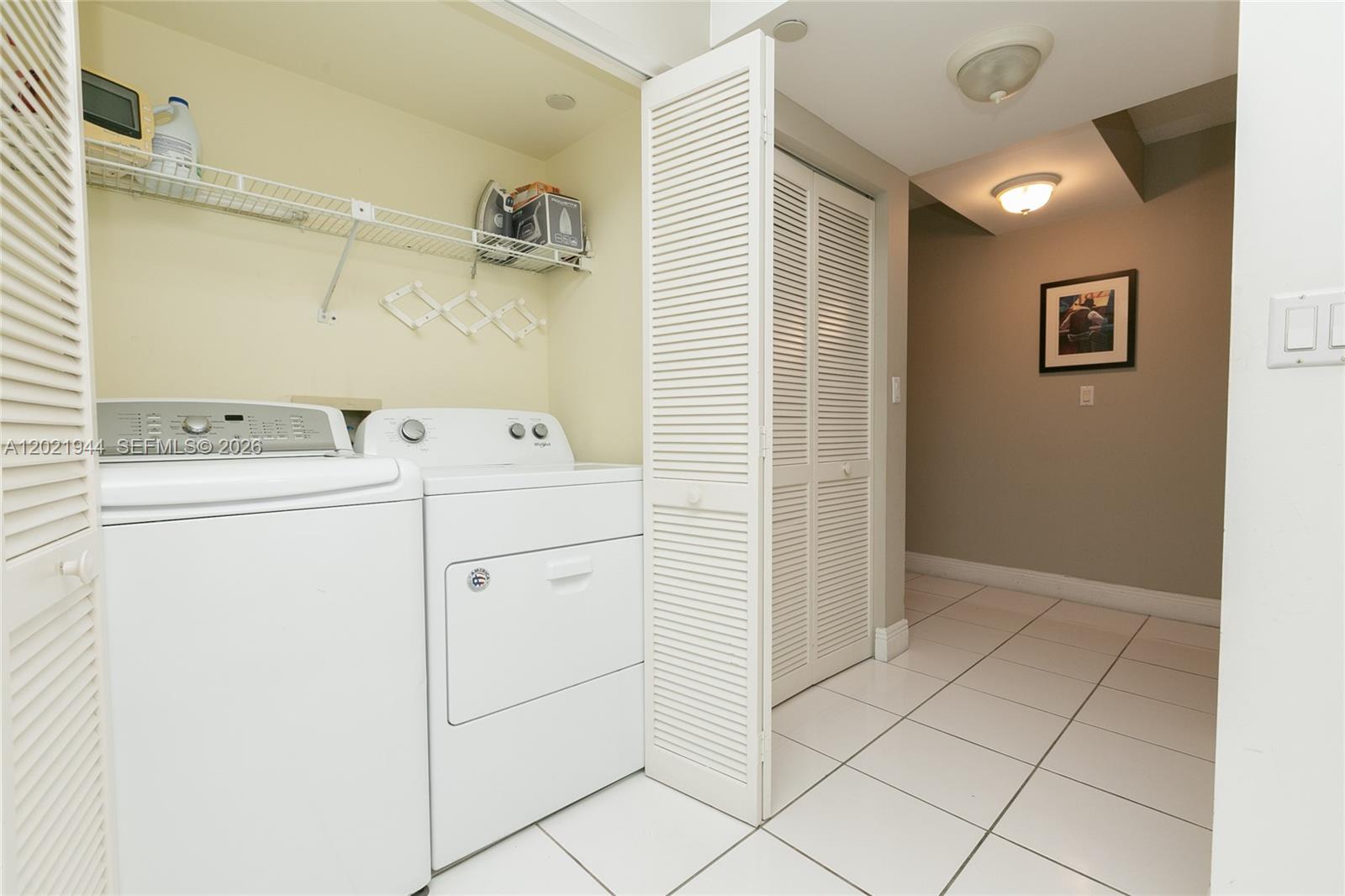8855 Collins Avenue, Unit 6F Surfside, FL 33154 - Photo 20 of 26 located in the kitchen behind the folding doors