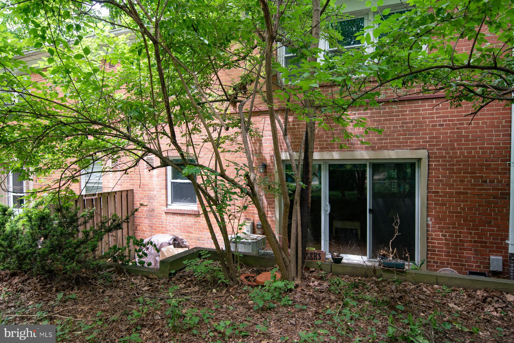 8603 Bradford Road, Unit 105 Silver Spring, MD 20901 - Photo 32 of 36 a front view of a house with garden