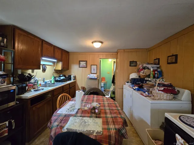a kitchen with a sink stove and cabinets