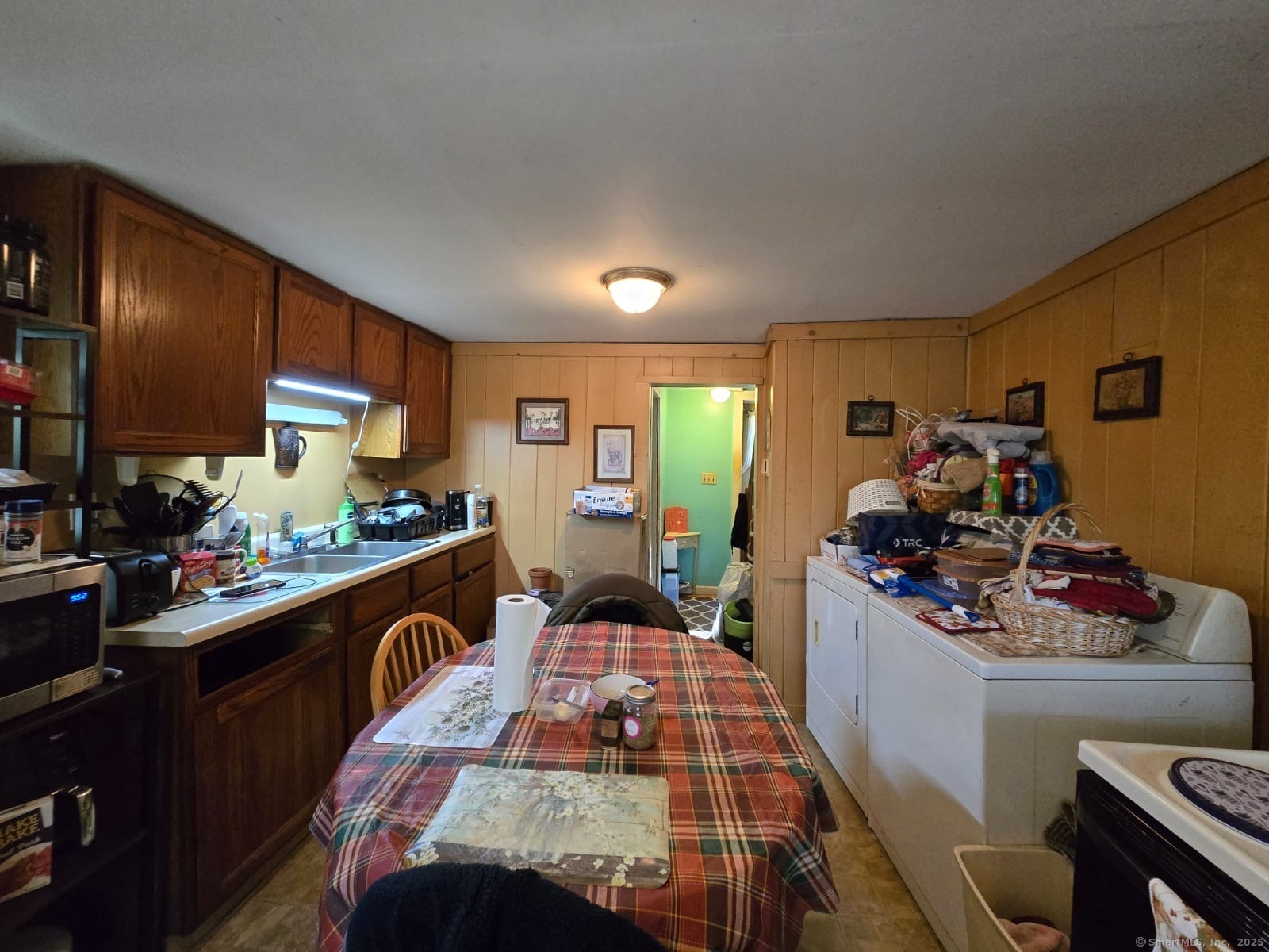 30 Riverside Drive Sprague, CT 06330 - Photo 12 of 38 a kitchen with a sink stove and cabinets