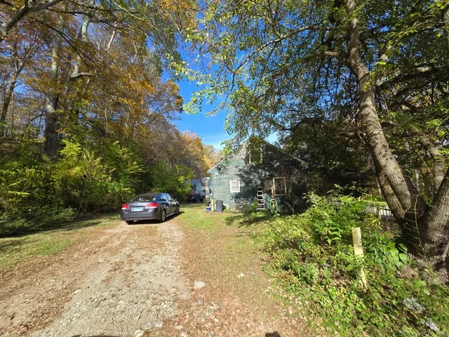 a view of backyard with green space