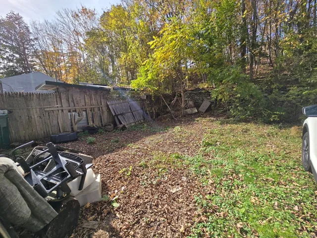 a backyard of a house with lots of green space