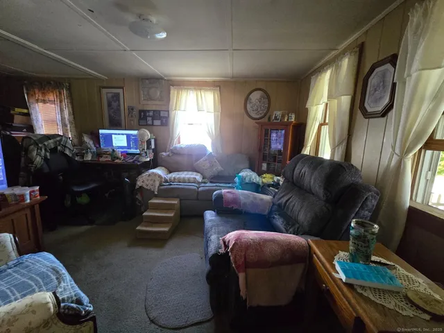 a living room with furniture and a window