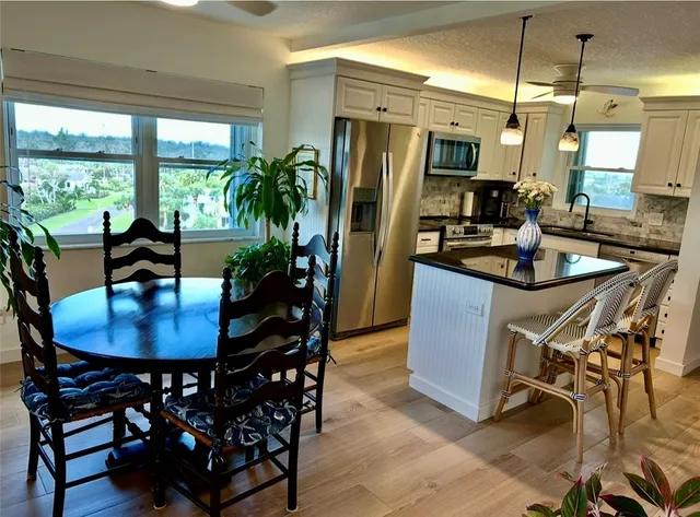 a view of a city with lush green forest