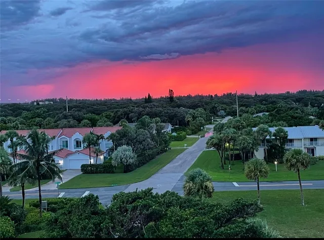 a kitchen with kitchen island a counter top space stainless steel appliances and cabinets