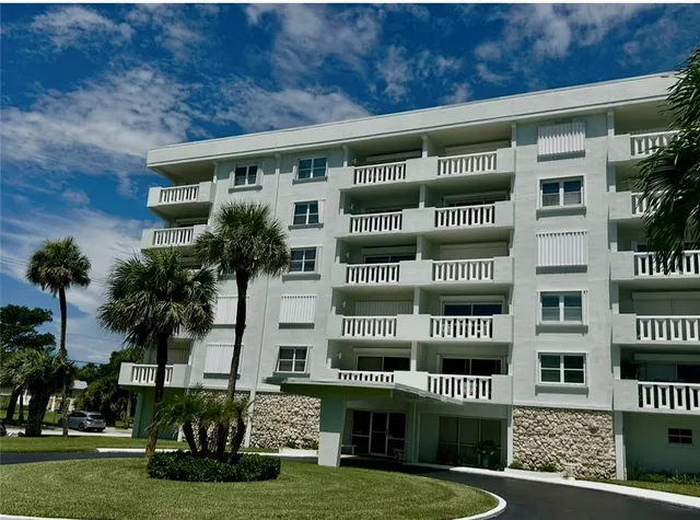 a picture of a building with a tree