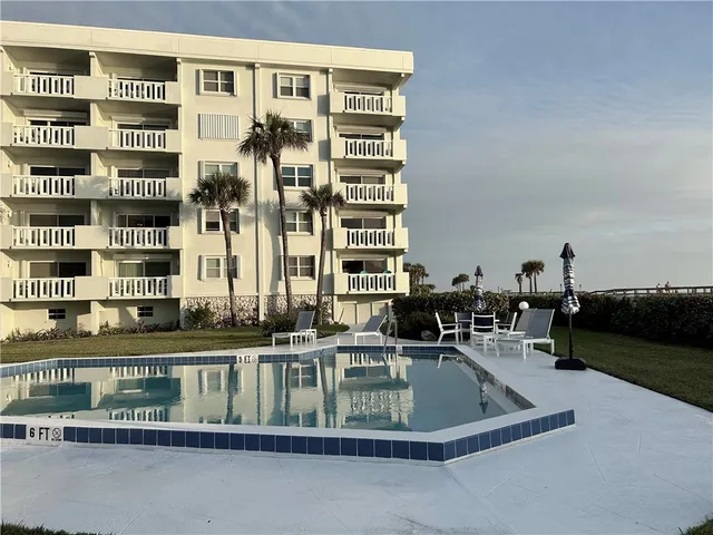 a view of balcony with furniture