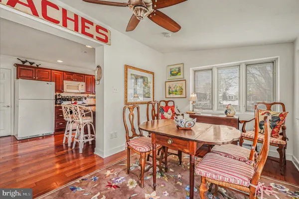 a very nice looking living room with dining room and wooden floor