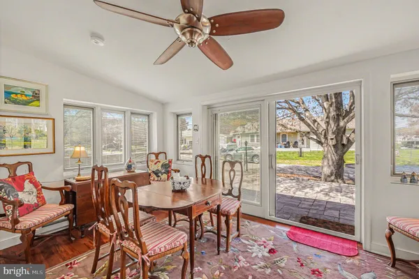 a view of a dining room with furniture window and wooden floor
