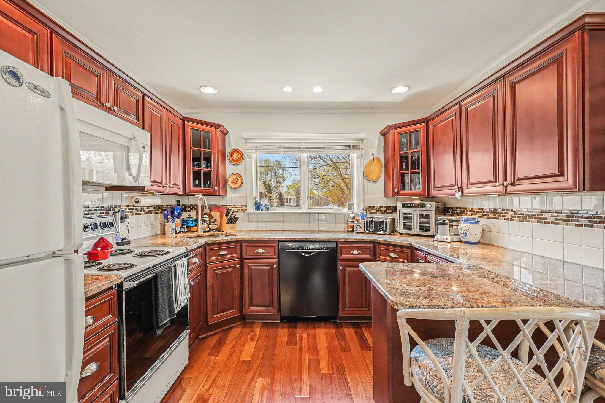112 Midway Drive Earleville, MD 21919 - Photo 19 of 47 a kitchen with stainless steel appliances granite countertop a sink stove and cabinets