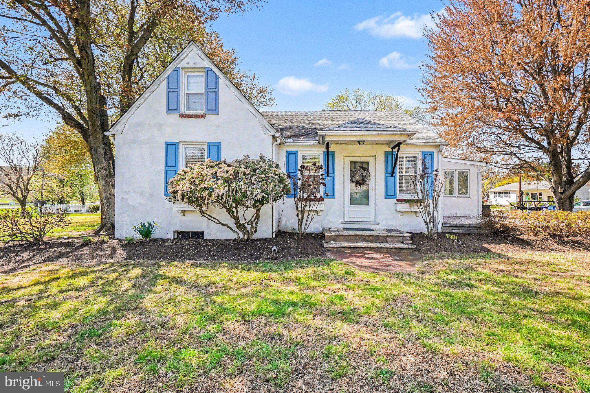 112 Midway Drive Earleville, MD 21919 - Photo 2 of 47 a view of a white house with a big yard and large tree and plants