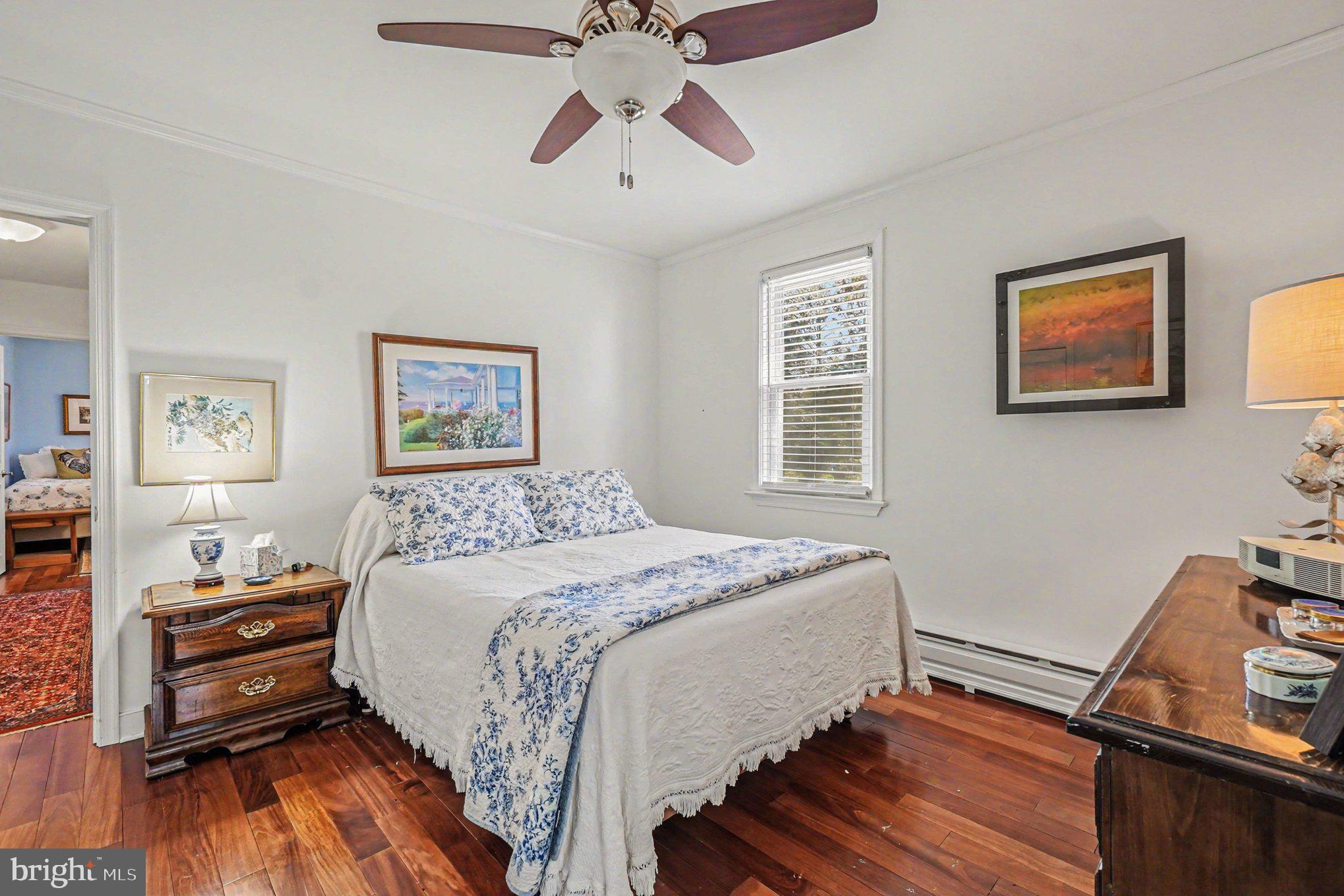 112 Midway Drive Earleville, MD 21919 - Photo 24 of 47 a bedroom with a bed and wooden floor